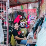 In Photo: Ms. Liza with here owned tailor products