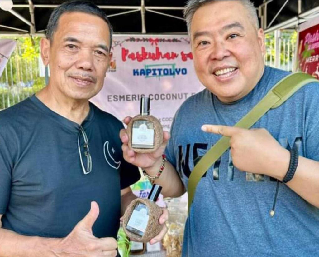 In Photo: Mr. Victor Esmeris with their local product lambanog