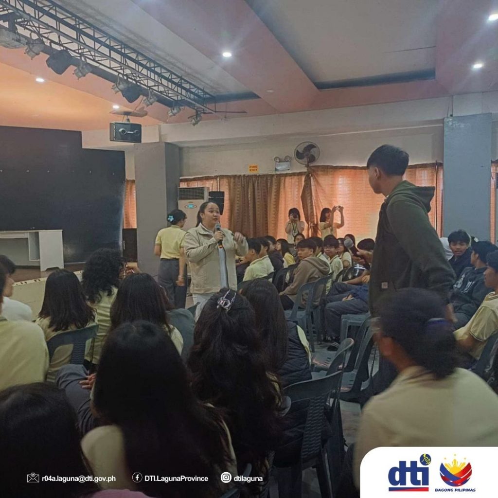 A resource speaker addresses the seated participants during the DTI-Laguna Seminar on Budget Management, held for future entrepreneurs and MSMEs at Holy Rosary College in Santa Rosa City, Laguna.