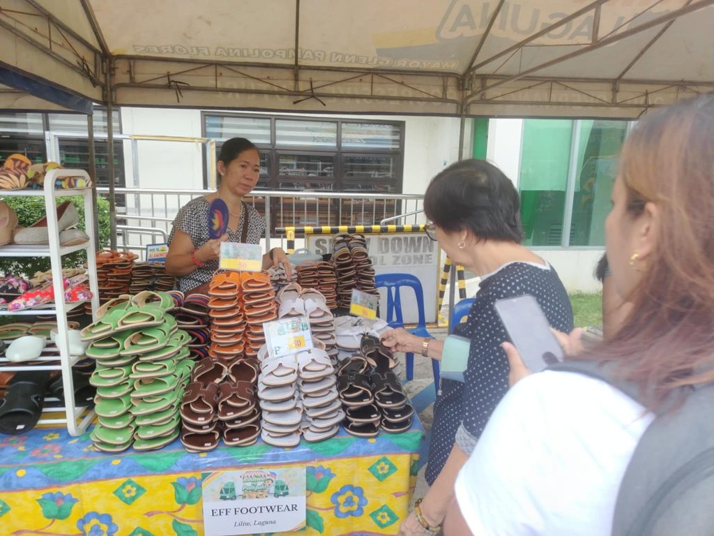 Local residents browsing MSME booths at the Kadiwa ng Pangulo trade fair in Alaminos.