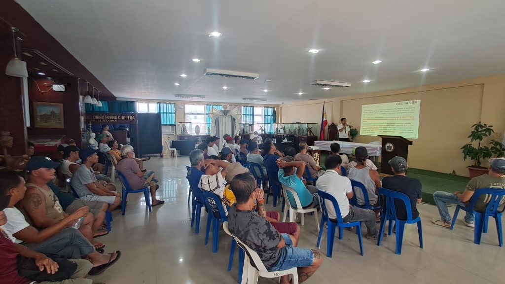 DTI Laguna, OVP, and LGU Paete officials and community members participate in the Mag Negosyo Ta ‘Day orientation meeting held in Paete, Laguna, showcasing discussions, presentations, and engagement with aspiring micro-entrepreneurs.