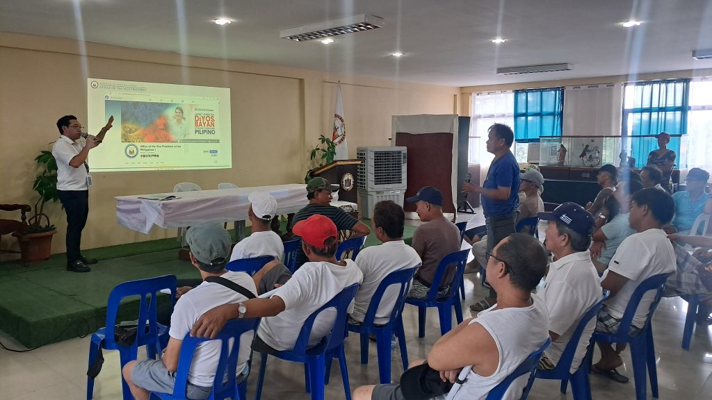 DTI Laguna, OVP, and LGU Paete officials and community members participate in the Mag Negosyo Ta ‘Day orientation meeting held in Paete, Laguna, showcasing discussions, presentations, and engagement with aspiring micro-entrepreneurs.