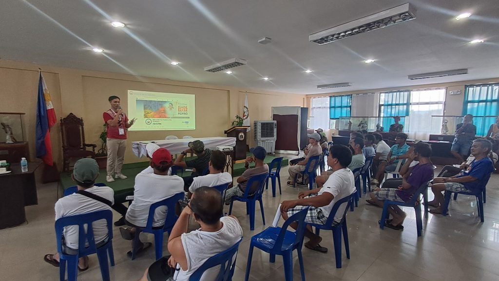 DTI Laguna, OVP, and LGU Paete officials and community members participate in the Mag Negosyo Ta ‘Day orientation meeting held in Paete, Laguna, showcasing discussions, presentations, and engagement with aspiring micro-entrepreneurs.