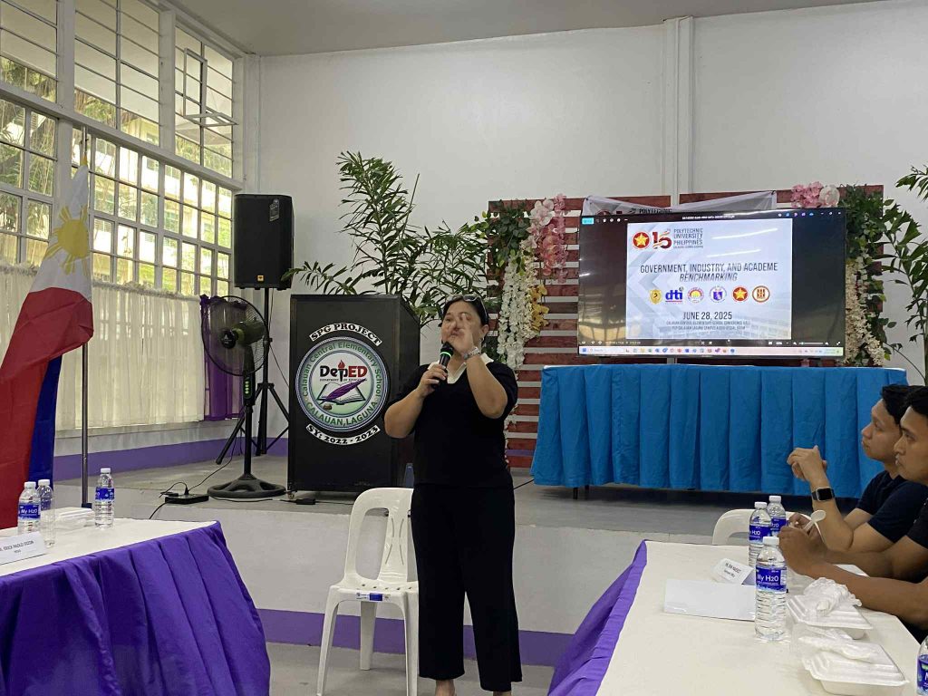 DTI-Laguna representatives presenting entrepreneurship programs to graduating students during the PUP-Calauan career deployment forum, highlighting support services like YEP, Negosyo Center, and SMERA.

