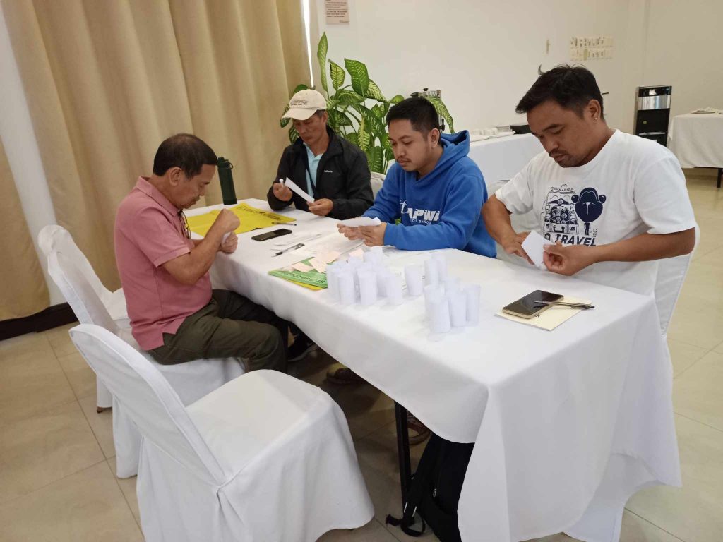 DTI-Laguna conducts BEST Game training for CFIDP coconut farmers in Los Baños, Laguna, enhancing financial literacy and promoting sustainable entrepreneurship through simulation-based learning and cooperative development.