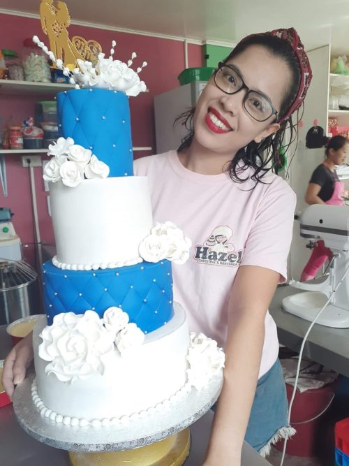 in photo: Ms. Hazel Christine Salmasan holding her cake product.