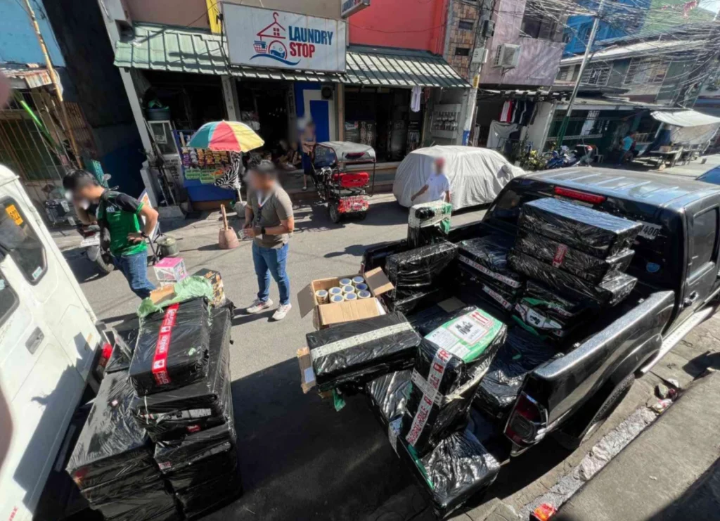 DTI officials inspecting confiscated vape products during a crackdown near schools, enforcing Republic Act No. 11900