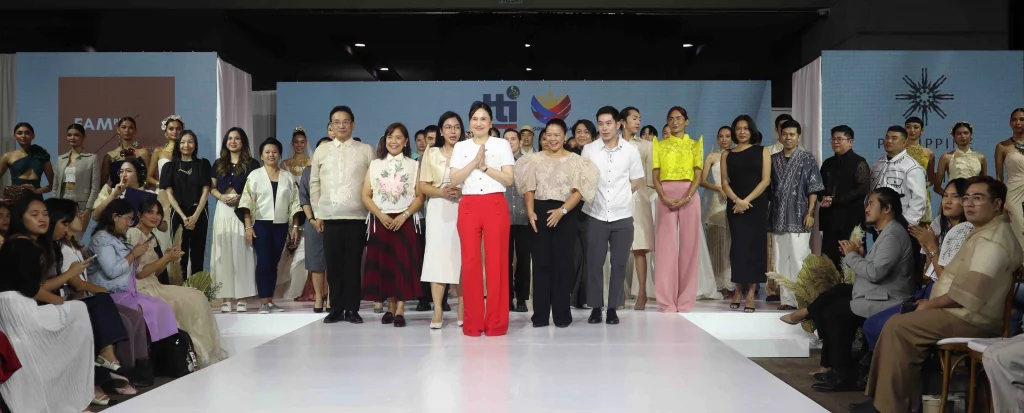 DTI Secretary Ma. Cristina A. Roque and participants pose on the runway stage during the DTI Wedding Fair 2025, celebrating Filipino culture and empowering women entrepreneurs through the launch of the Women’s Enterprise Fund