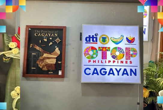 Framed map of the Province of Cagayan alongside a vibrant OTOP Philippines Cagayan signboard featuring DTI, Cagayan, and Bagong Pilipinas logos, highlighting the official launch of the OTOP Store in Tuguegarao City.