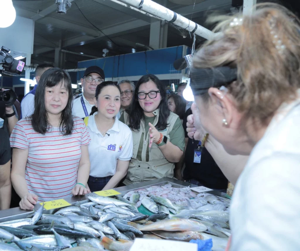 DTI Secretary Cristina A. Roque leads price monitoring in Quiapo, Manila to ensure compliance with the price freeze on basic necessities following the Habagat and cyclones aftermath.