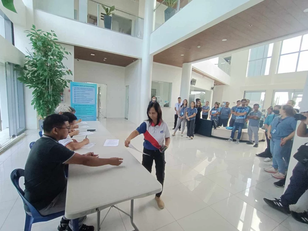 In photo: DTI staff assisting participants during the Timbangan ng Bayan project launch at the New Government Center in Pakil, Laguna.