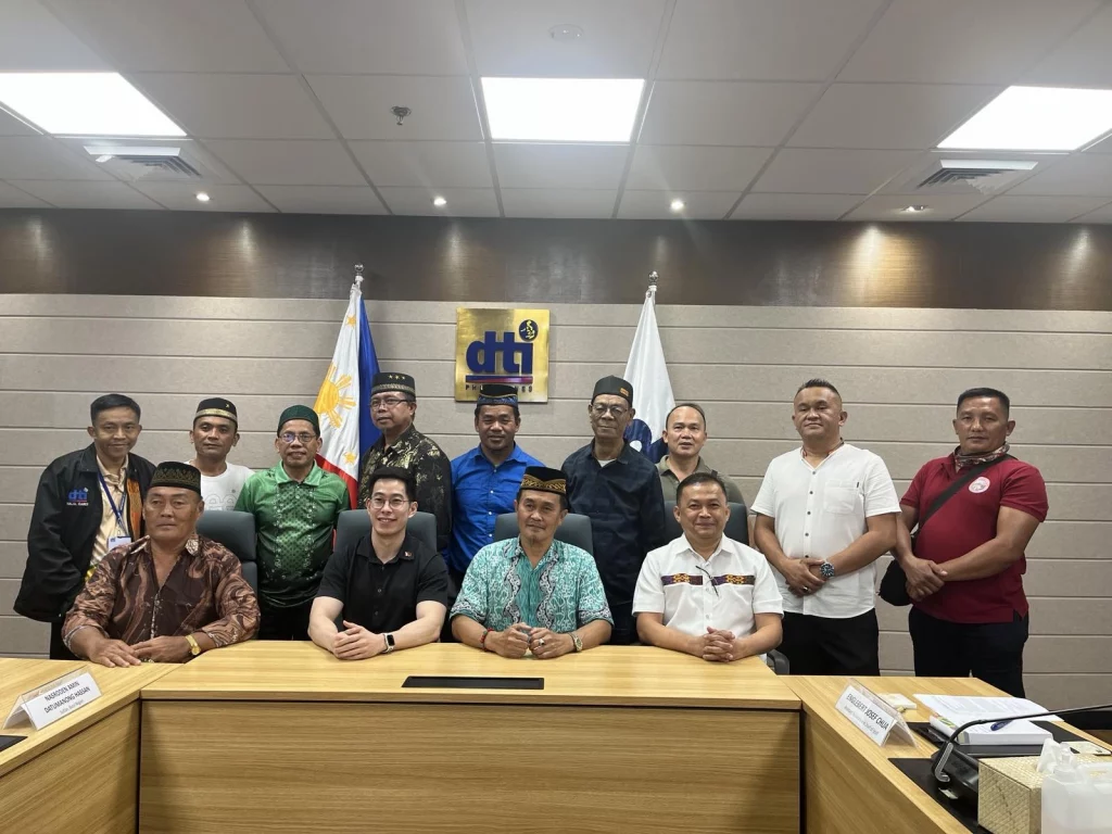 A group photo showing DTI Assistant Secretary and Chief-of-Staff Englebert Josef G. Chua with DTI staff members and Muslim sultans and community leaders during a courtesy call to discuss strategic initiatives for strengthening the Halal industry in the Bicol region.