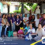 A group of DTI Region 8 staff wearing purple shirts poses alongside Barangay 79 Sirin officials and community members in Tacloban City. They are gathered around donated pre-loved clothing intended for local fire victims, taken on March 14, 2025, during an orientation on basic consumer rights and responsibilities.