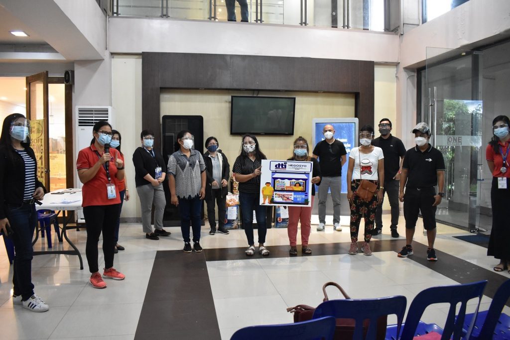 A group photo of DTI staff with the beneficiaries