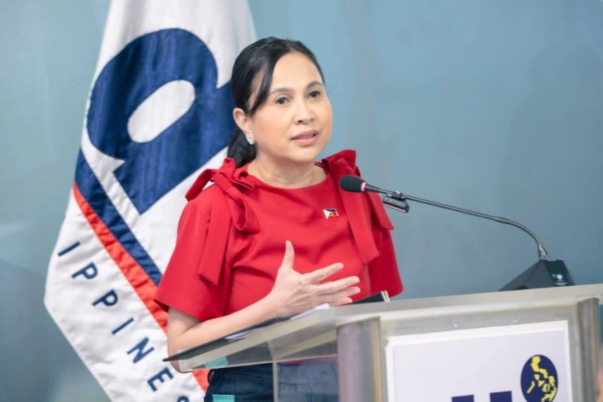 DTI Secretary Cristina A. Roque speaks at the podium during the launch of the Supply Chain and Logistics Center Hotline and Portal, highlighting government and private sector collaboration to support MSMEs in the Philippines.