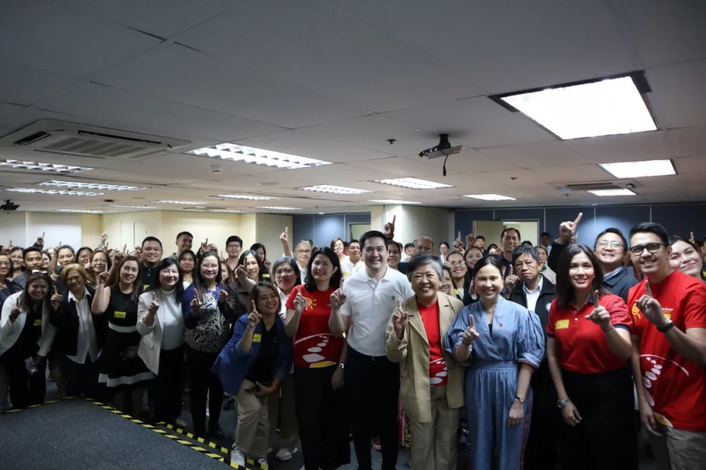 DTI Secretary Cristina Roque speaking to MSME participants during the Joy in Learning session at Jollibee Plaza, emphasizing livelihood and value chain integration under Bagong Pilipinas