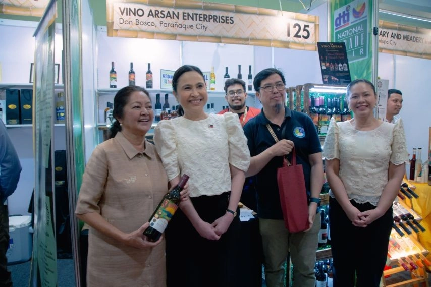 Representatives of Vino Arsan Enterprises pose at Booth 125 during the 2025 Bagong Pilipinas National Trade Fair, showcasing locally produced wines and products as part of the DTI’s support for MSMEs and sustainable Filipino entrepreneurship.