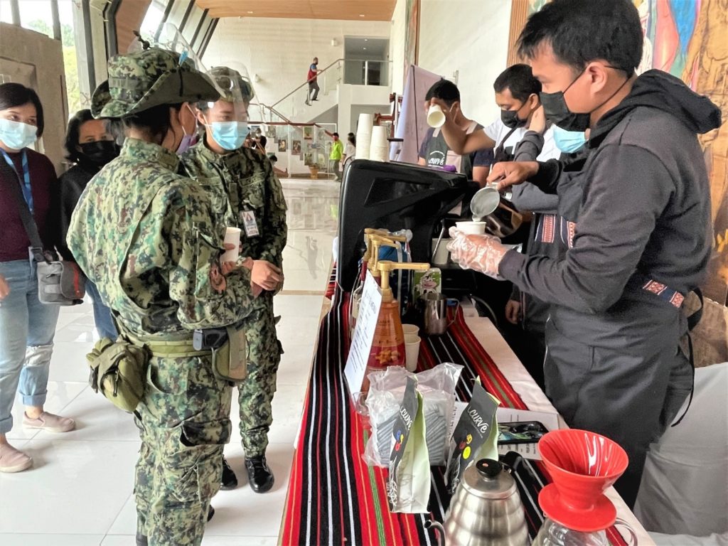Local baristas serving uniformed personnel