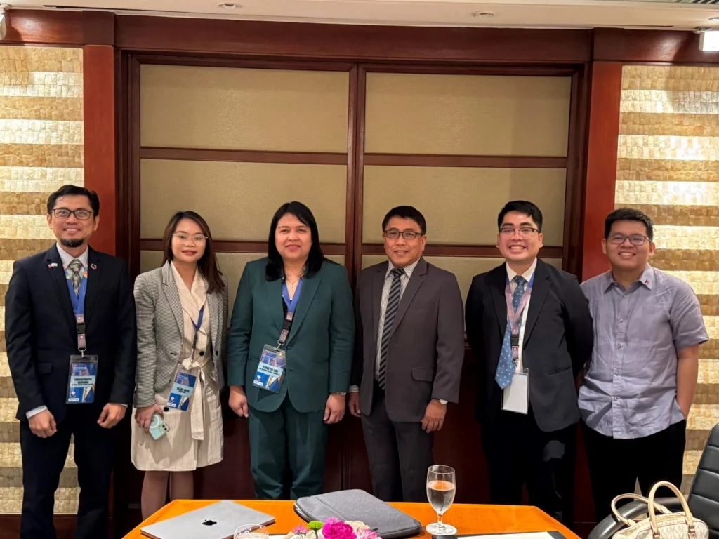A group of individuals, standing behind a table. From left to right, they are Mr. Edward Gacusana, Ms. Ma. Alliah Antig, Ms. Tonilyn Lim, Atty. Allan Gepty, Mr. Jan Redmond Dela Vega, and Mr. Lorenzo Pangilinan.
