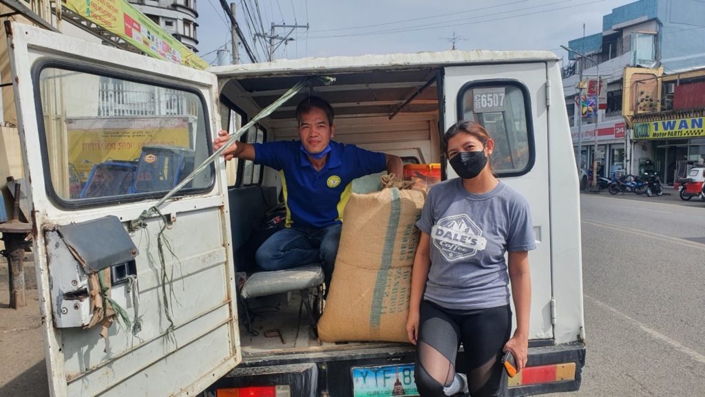 Hojap Multipurpose Cooperative members beside a sack of Ifugao coffee beans