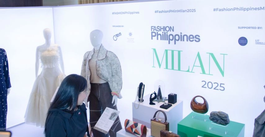 Trade and Industry Secretary Cristina A. Roque observes mannequins dressed in Filipino designer outfits at the FASHIONPhilippines MILAN 2025 exhibit, part of DTI-CITEM’s initiative to promote Philippine fashion and sustainable textiles ahead of Milan Fashion Week Spring/Summer 2026.