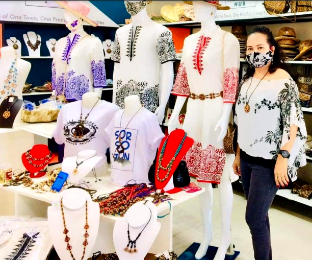 Ms. Valera poses with some of her products on display