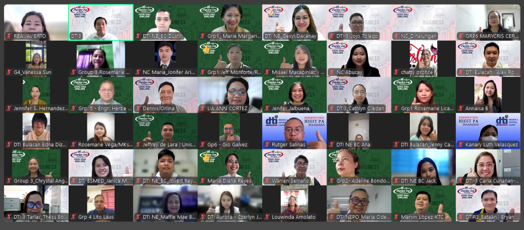 A screenshot of a virtual graduation ceremony for DTI’s KMME program, showing multiple participants in a grid layout with blurred faces and visible name tags, some using virtual backgrounds with logos and text.