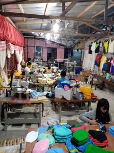 group of people producing washable face masks