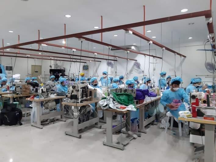 Workers producing PPEs