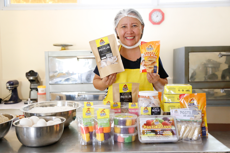 Baby Grace Dingsalan, owner of RichBlitz Sweets showing off their products