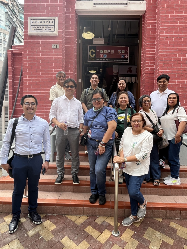 Group photo of the business mission taken at the entrance of the Red Market in Macau. Key officials include Atty. Genevieve E. Velicaria-Guevarra, CESE, Assistant Secretary for Agribusiness, Marketing, and Consumer Affairs, DA (2nd from left, 2nd row) ; Mr. Jerome D. Bunyi, Agriculture Counsellor to China (Leftmost, 2nd row); and Atty. Roberto B. Mabalot, Jr., Vice Consul Commercial and Commercial Attache, PTIC-HK (Leftmost, 1st row); 