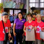 A group of weavers from Davao del Norte proudly showcasing their banana fiber bayong bags.