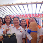 First Lady Liza Araneta Marcos with DTI ROG Asec. Dominic Tolentino, DTI R1 Regional director Merlie Membrere and DTI Region 1 staffs smling during the LAB For All Project.