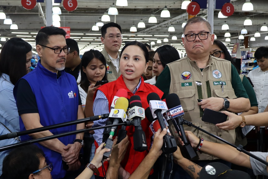 In photo: DTI Secretary and NPCC Chair Cristina A. Roque, DTI Assistant Secretary Agataon Uvero, and DA Secretary Francisco Tiu Laurel Jr. talking to the media.