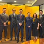 A group photo of eight individuals: four Japanese representatives and four Philippine trade officials. From left to right, they are are Mr. Yohei Kurisu, Mr. Shigeo Fukuda, Mr. Satoru Wachi, Mr. Shuichiro Ikemoto, DTI Secretary Cristina A. Roque, Special Trade Representative Dita Angara-Mathay, DTI Assistant Secretary Englebert Josef Chua, and DTI Assistant Secretary May Niña Celynne Layug.