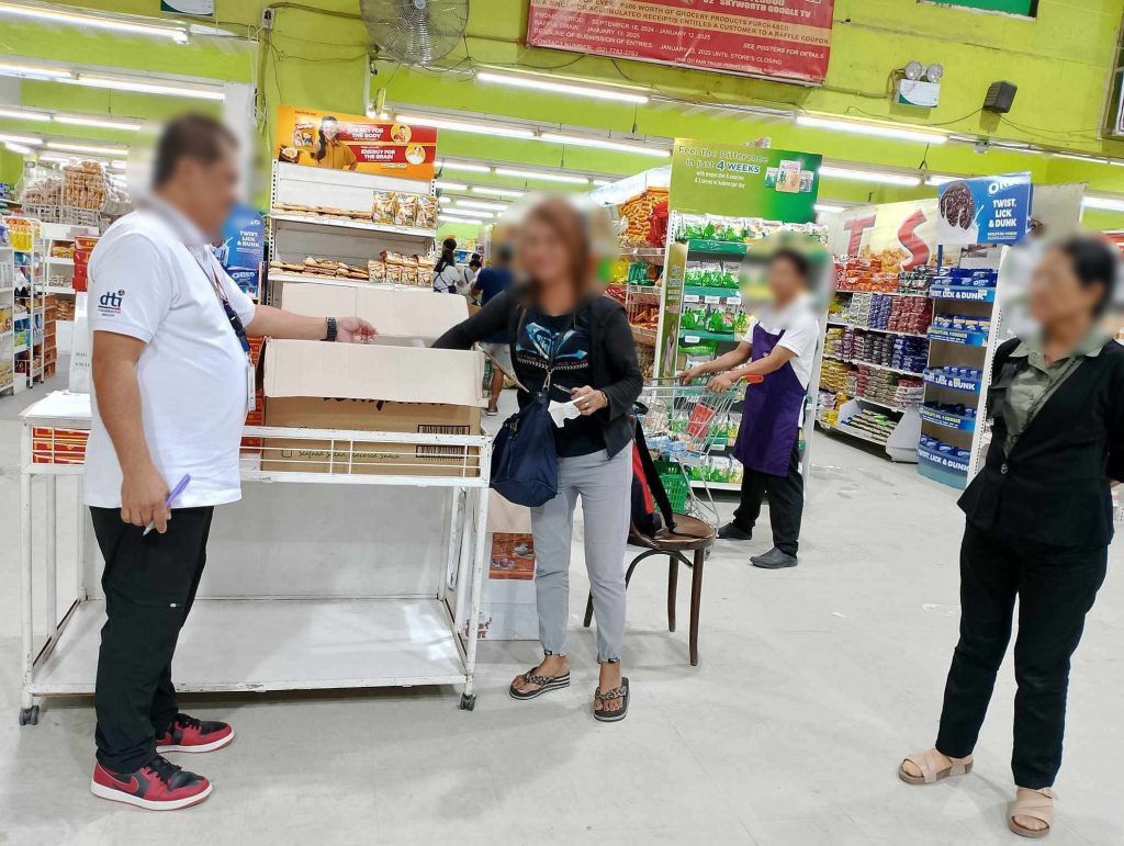 DTI Laguna representatives supervising a raffle draw in an establishment in Biñan City, Laguna