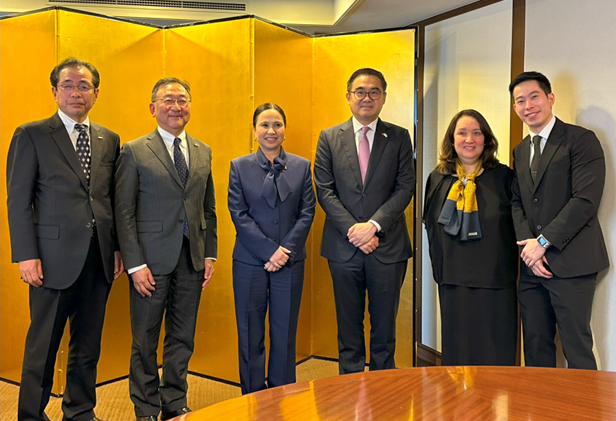 A group of six individuals pose for a photo in front of a gold folding screen. From left to right are Mr. Akinori Hanada, Mr. Mutsuki Tomono, Secretary Cristina A. Roque, SAPIEA Frederick D. Go, Special Trade Representative Dita Angara-Mathay, and DTI Assistant Secretary Englebert Josef Chua. 