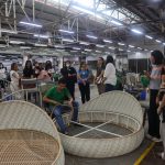 DTI Rizal and REMAI members touring Dedon Manufacturing, weavers crafting rattan furniture.